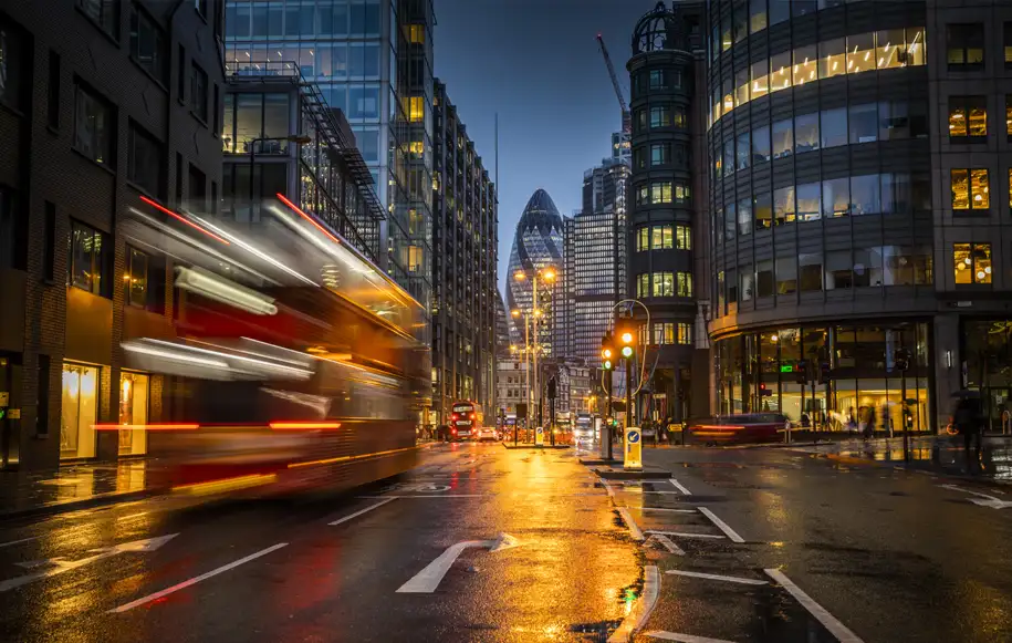 Central London cityscape at dusk showing the business district served by Pinpoint Drainage Services.