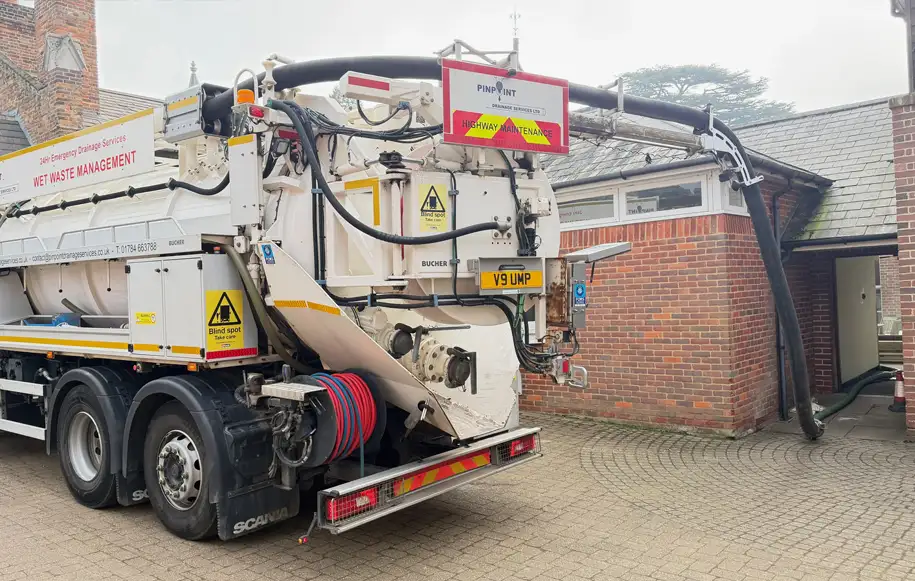 Vacuum tanker carrying out sewerage disposal and sewage waste removal from a commercial property.